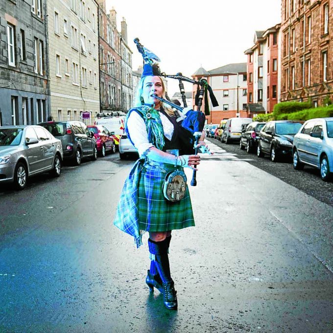 Scotland's national piper Louise Marshall plays her 95-year-old