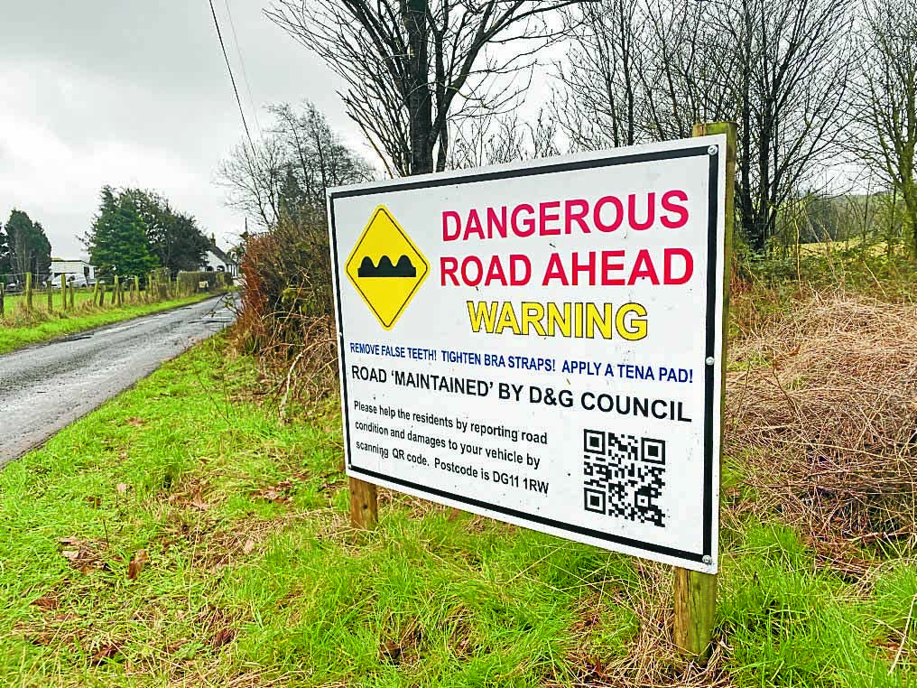 Country road sign warning to remove dentures, tighten up bras