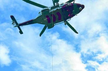 Woman winched off hill