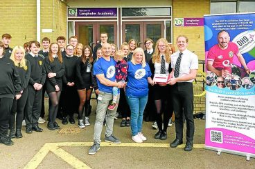 Charity gifts defib to schools